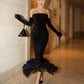 Black No shoulder features a sparkling sequin Dress